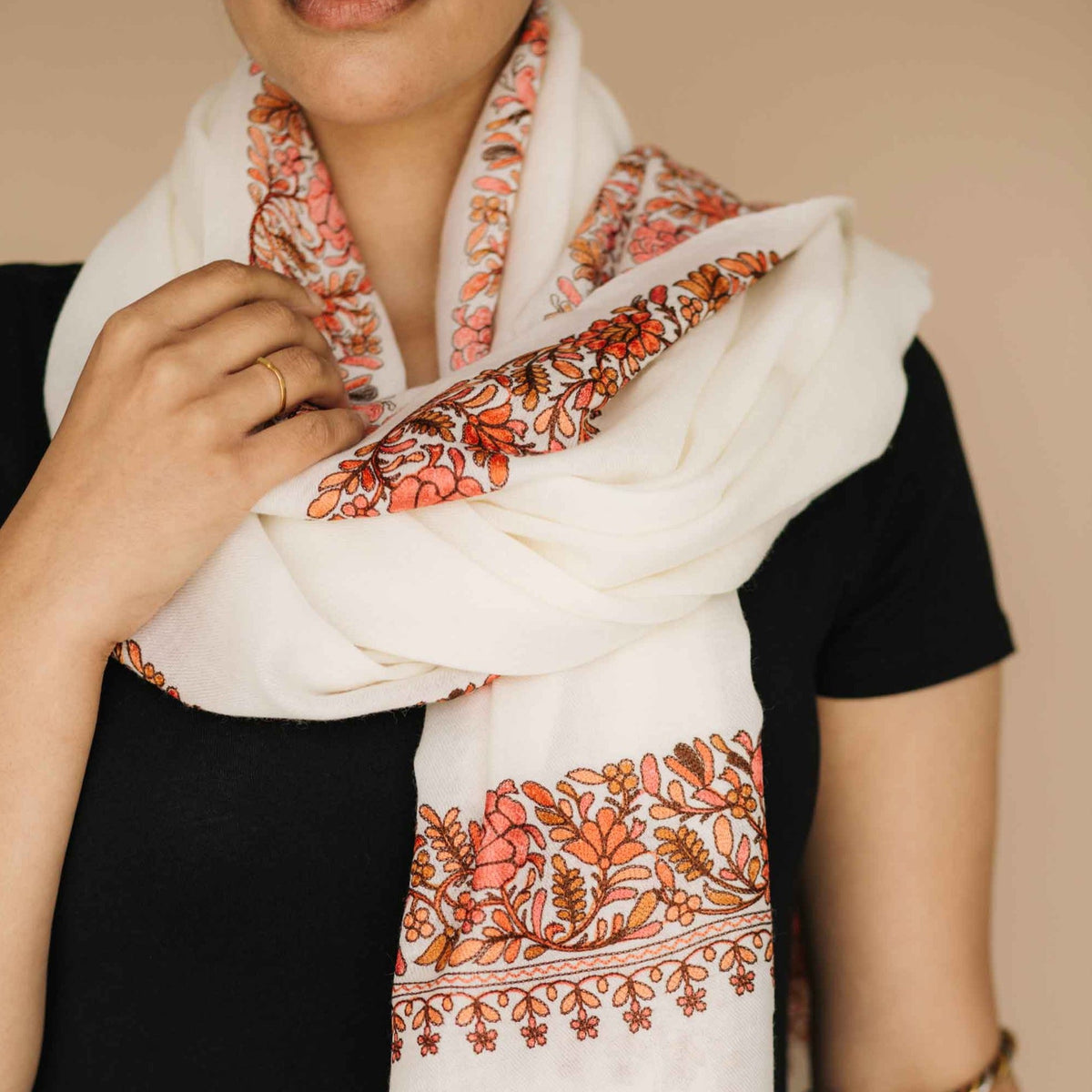 Cream wool shawl with orange embroidered border