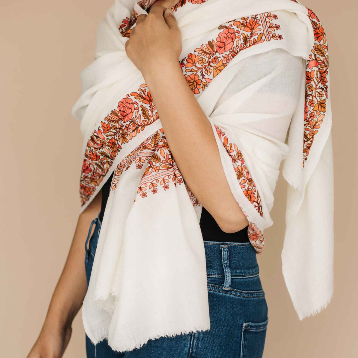 Cream wool shawl with orange embroidered border