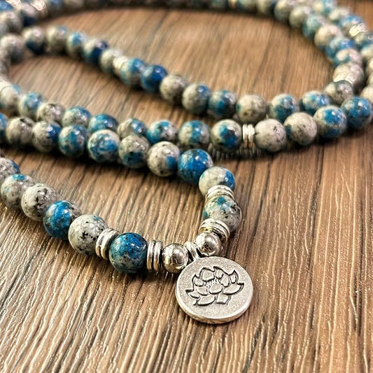 Azurite 108-bead mala necklace in blue and grey stone with lotus charm