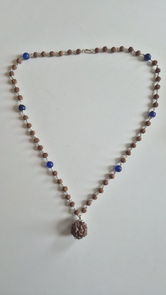 Blue lapis lazuli and rudraksha mala beads on silver links