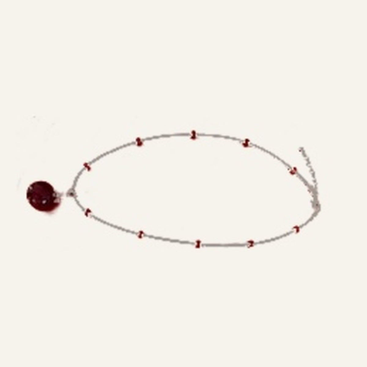 Actual red Venetian glass chakra pendant on handmade beaded chain against ivory background