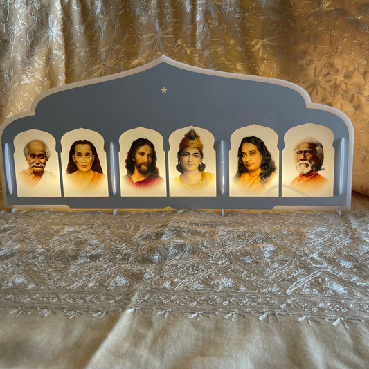 A handcrafted backlit home altar with sacred images, set for daily meditation