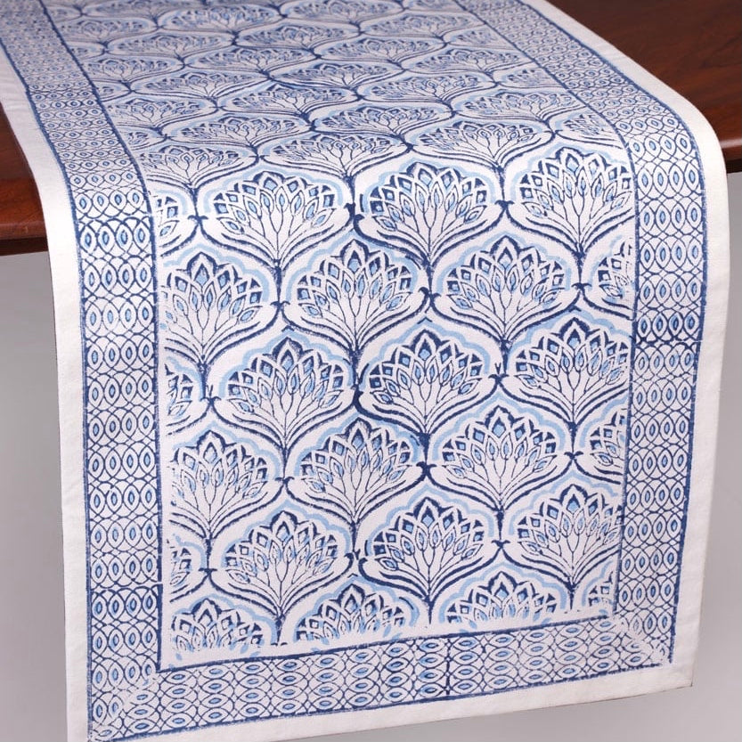 A blue lotus altar cloth covering a small home altar surface