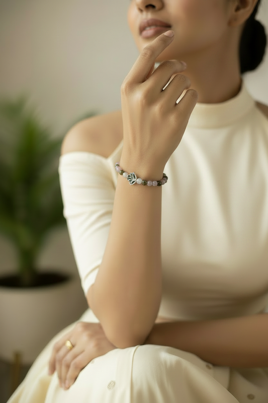 Rose quartz bead bracelet with silver lotus charm