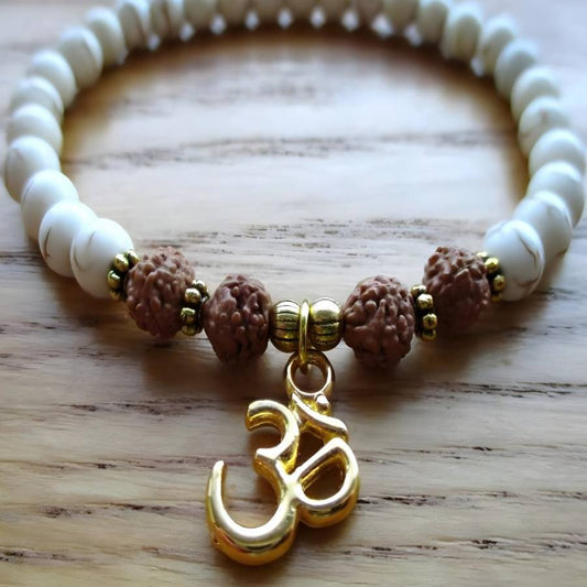 Cream bead and rudraksha bracelet with gold Om charm