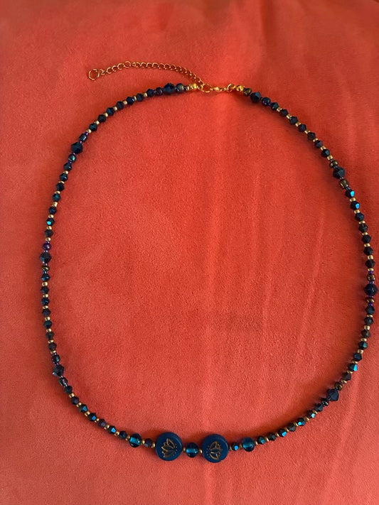 Original photo supplied by Laurie Baum showing necklace and its two lotus beads