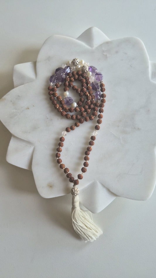 Faceted amethyst and freshwater pearl beads on rudraksha mala