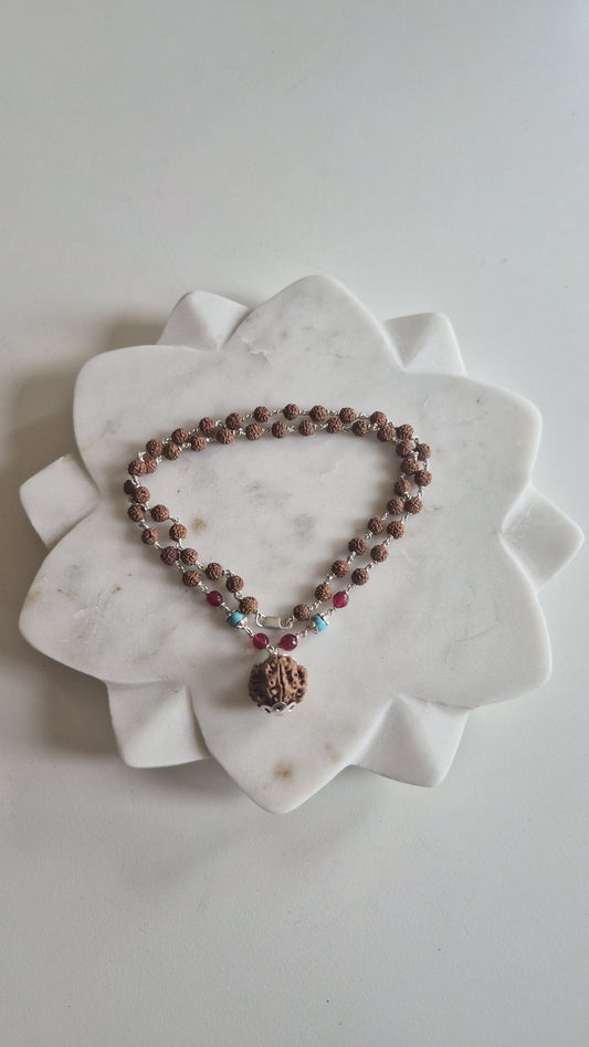 Rudraksha mala with turquoise and pink beads on silver links