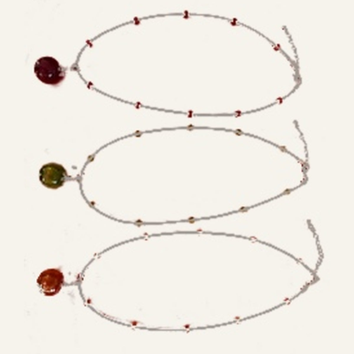 Original necklaces red, green and orange on warm ivory background
